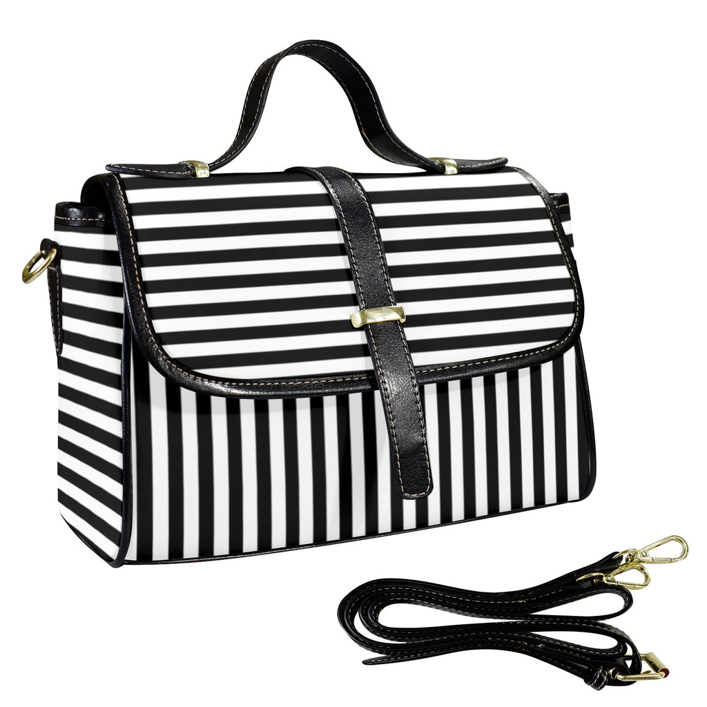 Black and white striped handbag designed by Alternawear with a detachable strap on a white background
