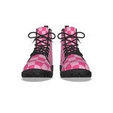 front view of Pair of pink checkered ladies punk boots with black soles on a white background