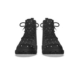 Black polka dot boots on a white background