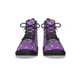 Purple boots with spooky skeleton animal print pattern on a white background by alternawear clothing combat lace up boot front view