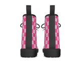 back of Pair of pink and black checkered boots on a white background