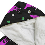 Black dressing gown with pink alien slug print close up of the hood which ic white inside.