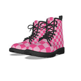 Pink checkered boots with black laces on a white background