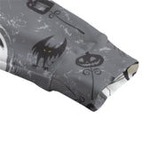 grey cardigan, zoomed shot of cuff, with 'Nightmare before Christmas' print.