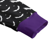 close up picture of purple cuffs on a black cardigan with white bat print