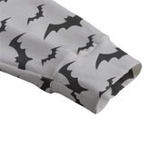 zoomed in shot the cuff of the grey cardigan with black bat print