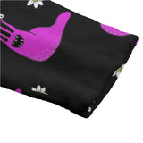 Black dressing gown with pink alien slug print, close up shot of the cuff.