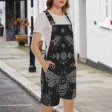 woman wearing Black celestial witchy style shortalls dungaree overalls with gray moth and moon phase pattern on a white background by Alternawear clothing front view