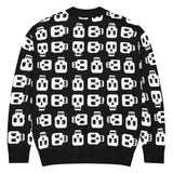 A black woven cardigan with white block skull print by Alternawear. The cardigan is fastened by four black buttons (back view).