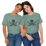 A white t-shirt with a black pirate skull and crossing cutlasses print on the front by Alternawear, being worn by two female models.
