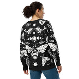 Model_showing_back_wearing_a_celestial_snake_print_cardigan_with_a_witchy_alternative_style_cozy_and_lightweight_knit.