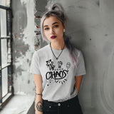 A woman with alternative fashion wearing a grey t-shirt with 'CHAOS' text and graphics on it, by Alternawear.