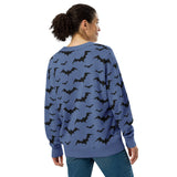 back view on a lady cozy knitted cardigan with bat print, featuring a relaxed unisex fit and soft jacquard knit texture — perfect for goth and spooky fashion lovers