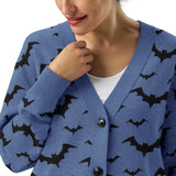 close up front view on a lady Cozy knitted cardigan with bat print, featuring a relaxed unisex fit and soft jacquard knit texture — perfect for goth and spooky fashion lovers
