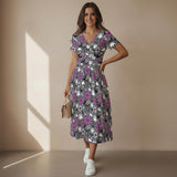 Woman wearing a skull spiderweb and ghost dress with a neutral background