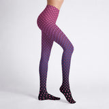 Purple tights with pink geometric pattern worn by a person on a white background