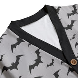 zoomed in shot of the grey cardigan with black bat print on the colour section of the garment