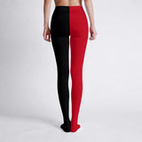 Black and red leggings worn by a person on a white background