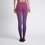Pink and purple patterned leggings worn by a person on a white background