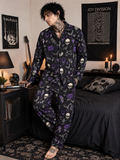 Person wearing a dark pajama set with skull patterns in a bedroom setting.