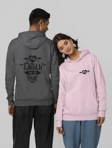 'Til Death Do Us Part' Hoodie's being  worn by a man in grey  facing away and a women in light pink facing forward leaning on the man.