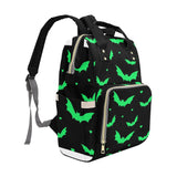 Side view of the black that also shows straps with a bright green bat and mini heart print 