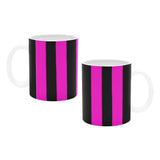 shot of two coffee mugs both which are both pink and black striped with white handles 